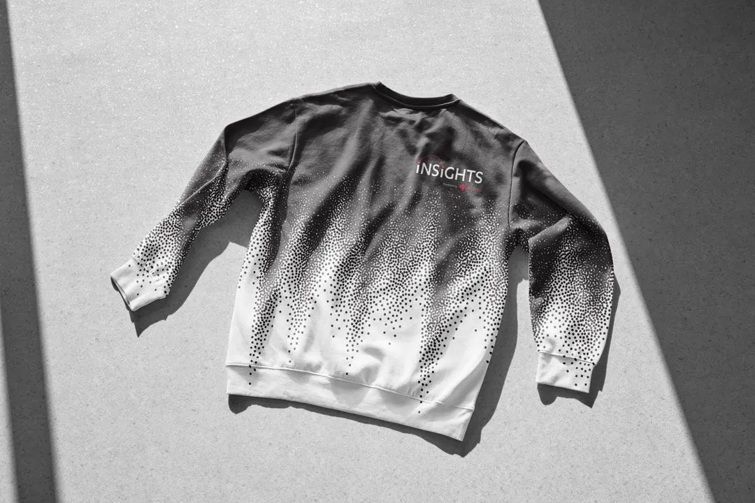 An Insights crewneck with a black-to-white dot gradient and the Insights logo