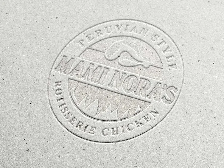 Mami Nora's Peruvian Style Rotisserie Chicken seal, debossed into gray board