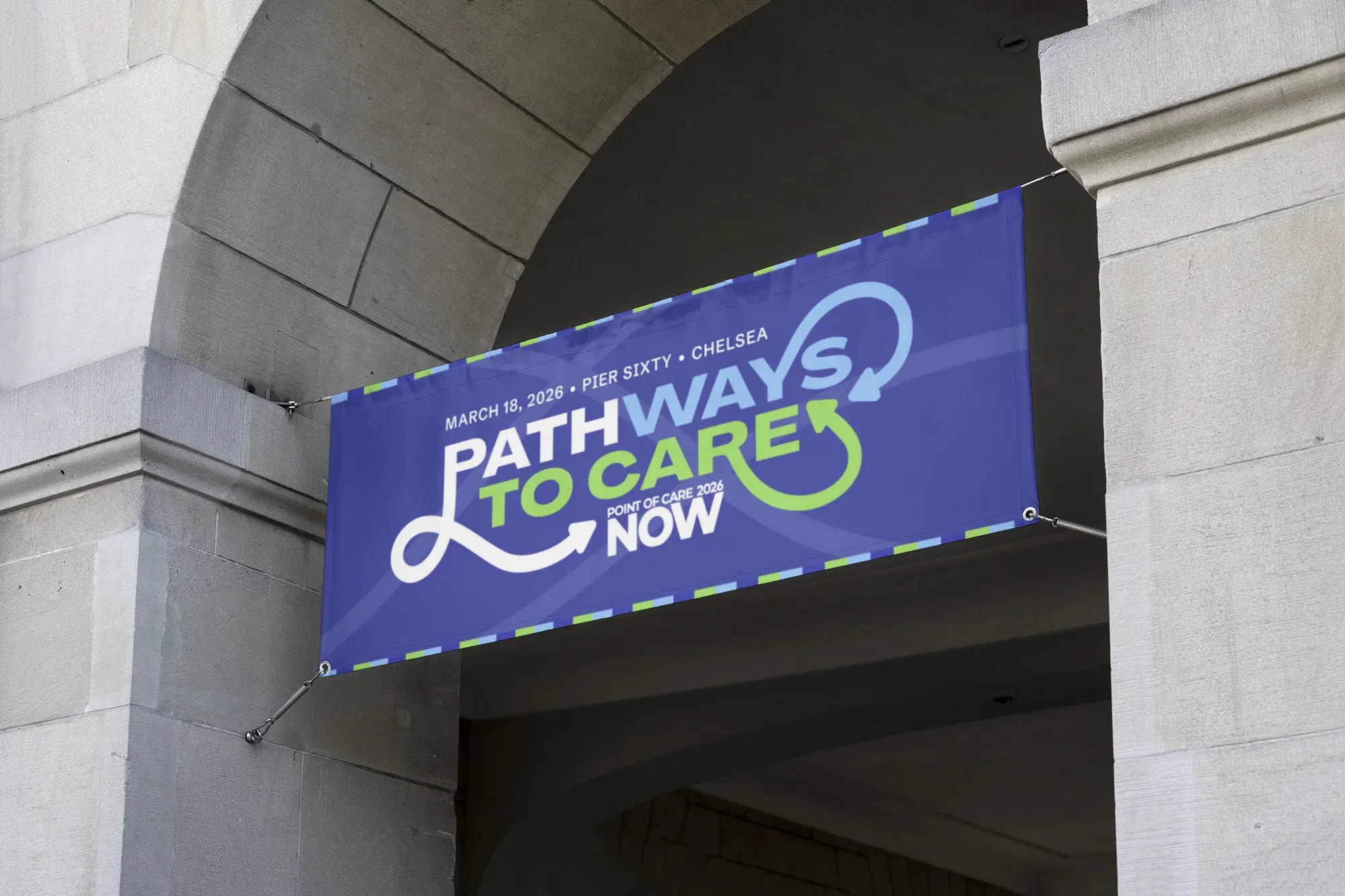 An outdoor banner over a stone archway: Pathways to Care, Point of Care 2026 NOW, March 18, 2026, Pier Sixty, Chelsea, with the striped edge top and bottom